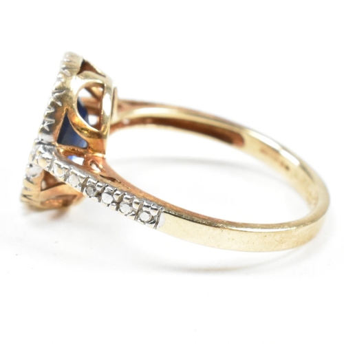 393 - A hallmarked 9ct gold, sapphire and diamond ring. The ring having an oval cut sapphire set in a whit... 