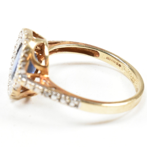 393 - A hallmarked 9ct gold, sapphire and diamond ring. The ring having an oval cut sapphire set in a whit... 