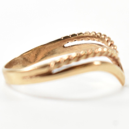 397 - A hallmarked 9ct gold two strand wishbone ring. The pierced 9ct gold wishbone ring having a twisted ... 