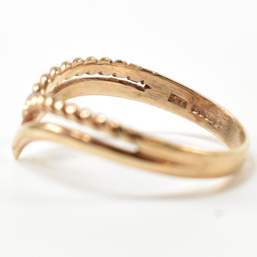 397 - A hallmarked 9ct gold two strand wishbone ring. The pierced 9ct gold wishbone ring having a twisted ... 