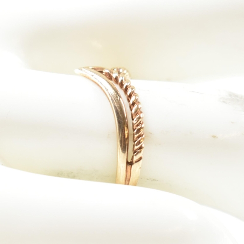 397 - A hallmarked 9ct gold two strand wishbone ring. The pierced 9ct gold wishbone ring having a twisted ... 