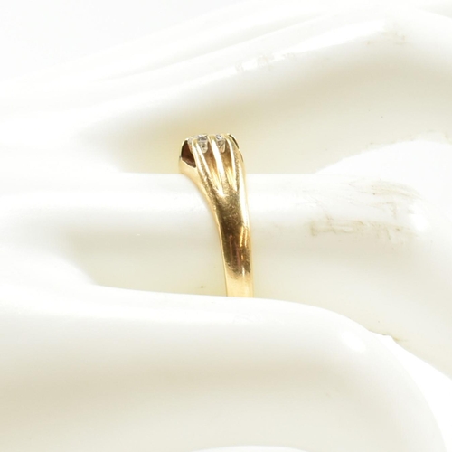 401 - A hallmarked 18ct gold and diamond ring. The ring having a claw mounted round brilliant cut diamond.... 