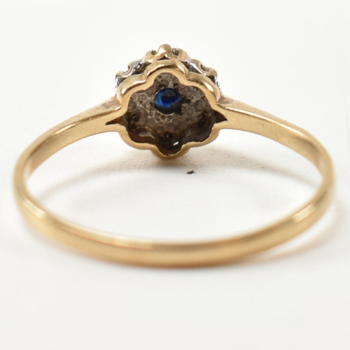 405 - A hallmarked 9ct gold, sapphire and diamond cluster ring. The ring having a central six claw set rou... 