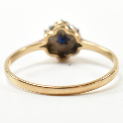 405 - A hallmarked 9ct gold, sapphire and diamond cluster ring. The ring having a central six claw set rou... 