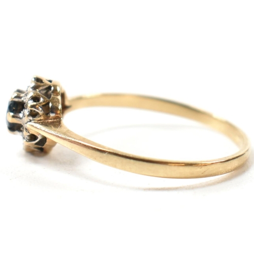 405 - A hallmarked 9ct gold, sapphire and diamond cluster ring. The ring having a central six claw set rou... 