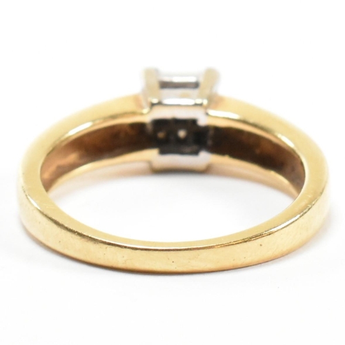 43 - A hallmarked 18ct gold and diamond cluster ring. The ring set with six princess cut diamonds to a sq... 