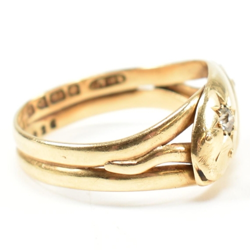 46 - An Edwardian hallmarked 18ct gold and diamond twin snake ring. The ring in the form of two coiled sn... 