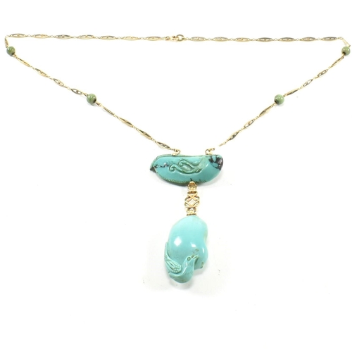 5 - A 14ct gold and carved turquoise pendant necklace. The necklace strung with a carved turquoise drop ... 