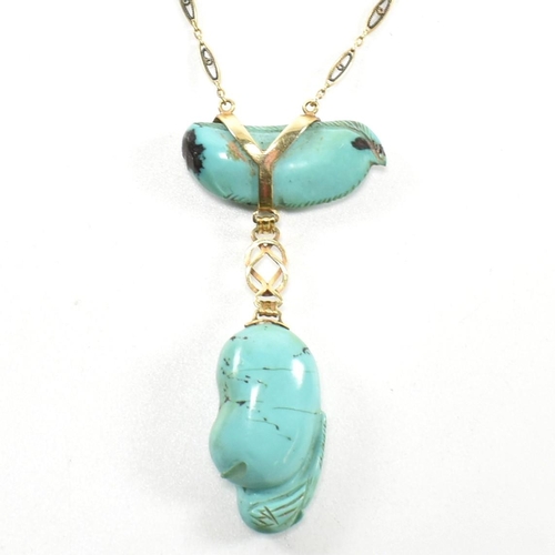 5 - A 14ct gold and carved turquoise pendant necklace. The necklace strung with a carved turquoise drop ... 