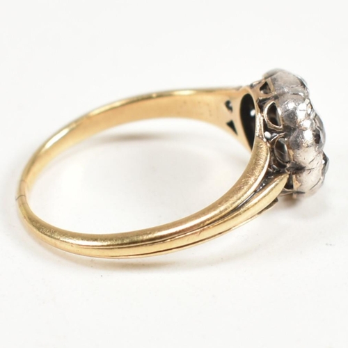 51 - A gold and diamond cluster ring. The ring having a central old cut diamond surrounded by a halo of t... 