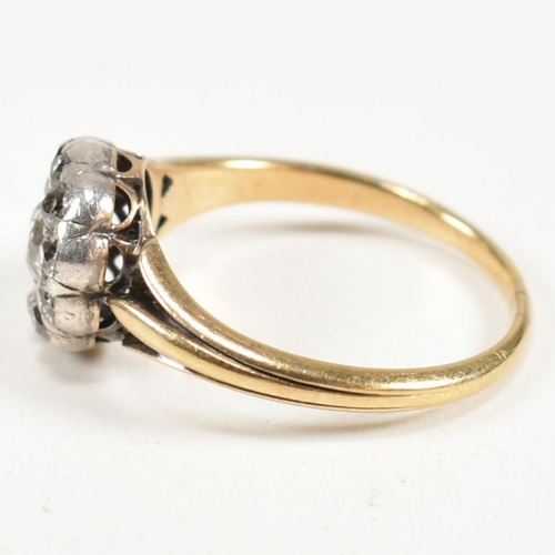 51 - A gold and diamond cluster ring. The ring having a central old cut diamond surrounded by a halo of t... 