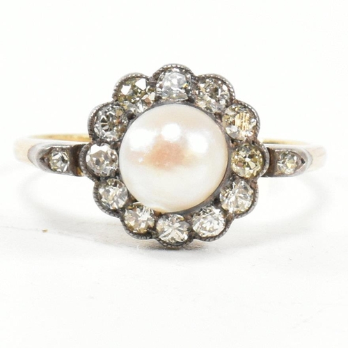 53 - An early 20th century pearl and diamond cluster ring. The ring set with a central half pearl framed ... 