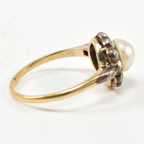 53 - An early 20th century pearl and diamond cluster ring. The ring set with a central half pearl framed ... 