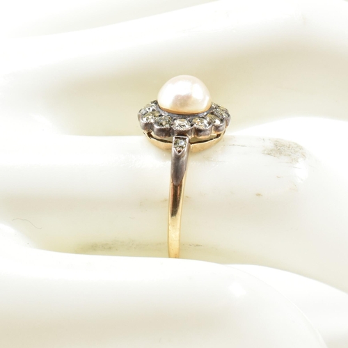 53 - An early 20th century pearl and diamond cluster ring. The ring set with a central half pearl framed ... 