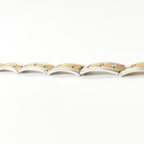 55 - An Italian 18ct gold screw detail link bracelet. The bracelet having two-tone yellow and white 18ct ... 