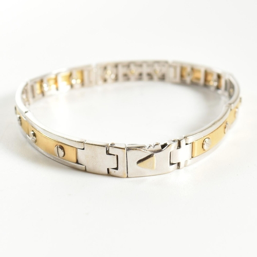 55 - An Italian 18ct gold screw detail link bracelet. The bracelet having two-tone yellow and white 18ct ... 