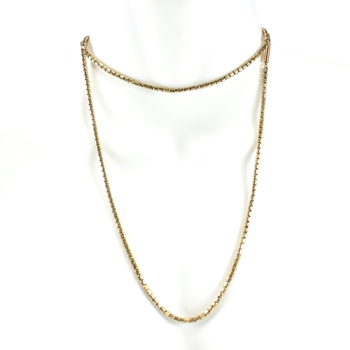 59 - A 9ct gold fancy link chain necklace. The necklace having fancy pierced barrel shaped links to barre... 