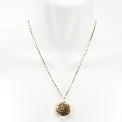 60 - A 9ct gold locket pendant necklace. The 9ct gold round engraved locket strung on a curb link chain n... 