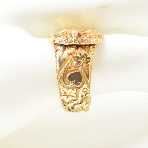 61 - An Edwardian hallmarked 18ct gold buckle ring. The 18ct gold belt buckle ring having an all-over fol... 