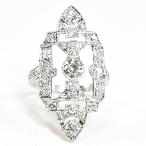 62 - A platinum and diamond panel ring. The ring having a large diamond set pierced panel head. Estimated... 