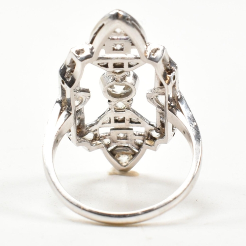 62 - A platinum and diamond panel ring. The ring having a large diamond set pierced panel head. Estimated... 