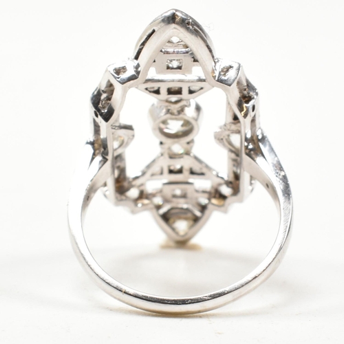 62 - A platinum and diamond panel ring. The ring having a large diamond set pierced panel head. Estimated... 