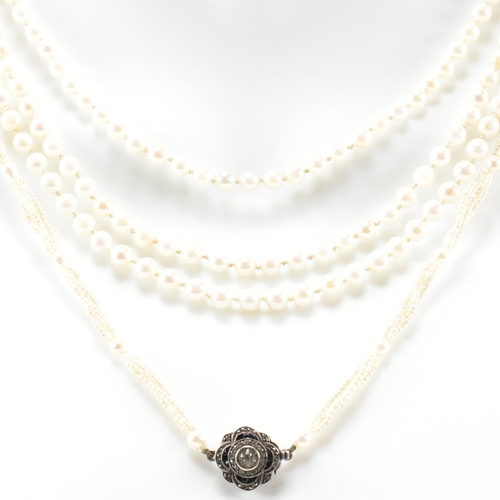 64 - Two pearl necklaces. A seed pearl necklace formed with triple twisted strings of seed pearls with pe... 