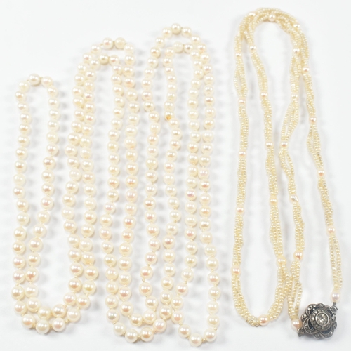 64 - Two pearl necklaces. A seed pearl necklace formed with triple twisted strings of seed pearls with pe... 