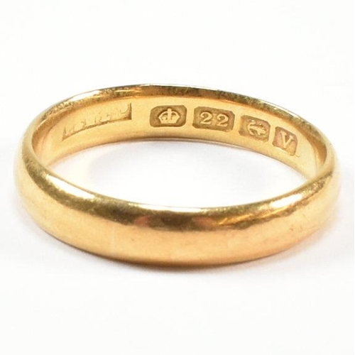 65 - A hallmarked 22ct gold band ring. Hallmarked for Birmingham, 1945. Sponsor's mark rubbed. Size P.5. ... 