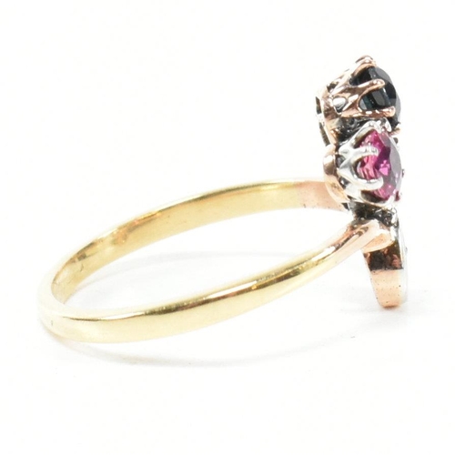 67 - An Art Nouveau ruby, sapphire and diamond ring. The ring having a round mixed cut ruby and sapphire ... 