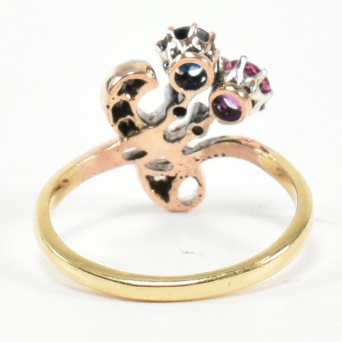 67 - An Art Nouveau ruby, sapphire and diamond ring. The ring having a round mixed cut ruby and sapphire ... 