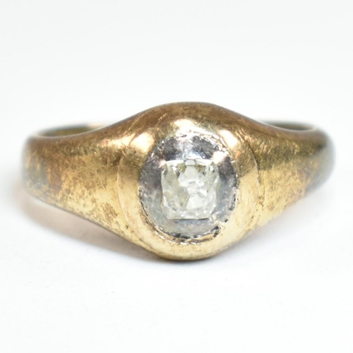 69 - An 18ct gold and diamond domed solitaire ring. The ring set with a central old square cut diamond se... 