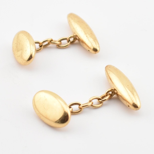 71 - A pair of hallmarked gold torpedo cufflinks. The cufflinks having torpedo heads united by chain. Par... 