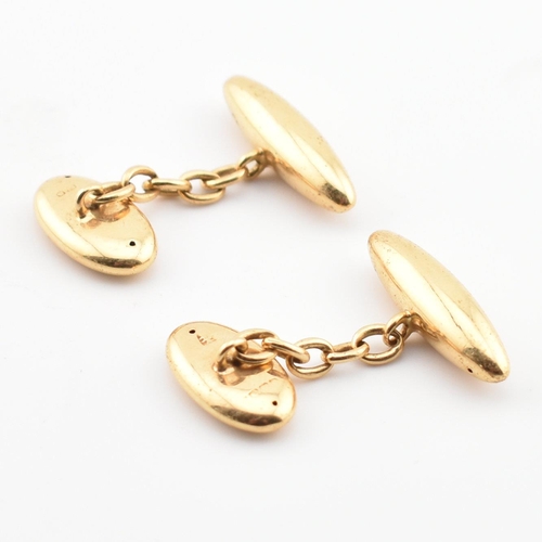 71 - A pair of hallmarked gold torpedo cufflinks. The cufflinks having torpedo heads united by chain. Par... 