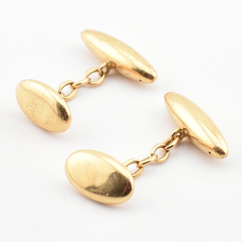 71 - A pair of hallmarked gold torpedo cufflinks. The cufflinks having torpedo heads united by chain. Par... 