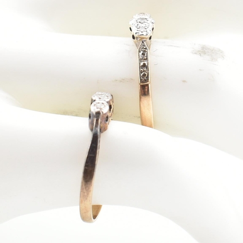 76 - Two vintage 9ct gold and platinum diamond three stone rings. The rings having three illusion set dia... 