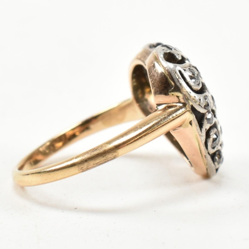 8 - A Victorian pierced diamond heart ring. The Art Nouveau ring having a pierced old cut diamond set he... 