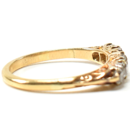 82 - An 18ct gold and diamond five stone ring. The antique 18ct gold ring having five graduating round cu... 