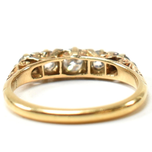 82 - An 18ct gold and diamond five stone ring. The antique 18ct gold ring having five graduating round cu... 