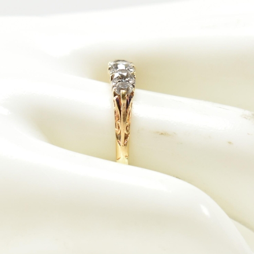 82 - An 18ct gold and diamond five stone ring. The antique 18ct gold ring having five graduating round cu... 