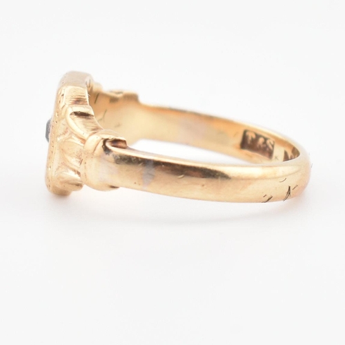 85 - A hallmarked 9ct gold and diamond signet ring. The ring having a star set old cut diamond to acanthu... 