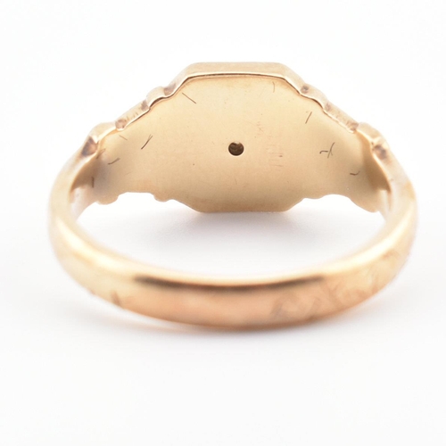 85 - A hallmarked 9ct gold and diamond signet ring. The ring having a star set old cut diamond to acanthu... 