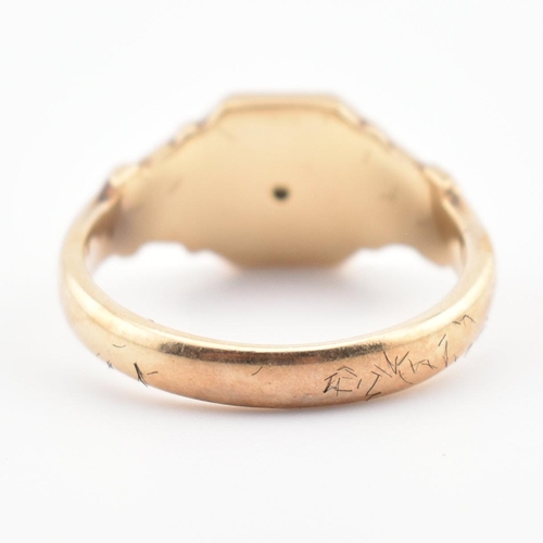 85 - A hallmarked 9ct gold and diamond signet ring. The ring having a star set old cut diamond to acanthu... 