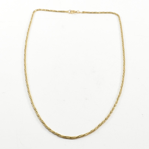 86 - An 18ct gold twisted chain necklace. The twisted chain necklace marked 750 to spring ring clasp. Mea... 