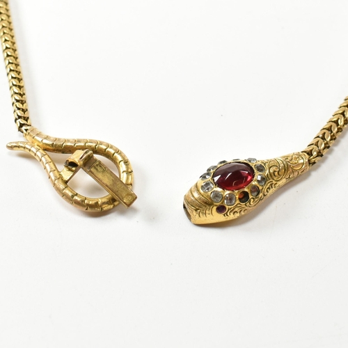 88 - A late Victorian/early Edwardian gilt metal and paste snake necklace. The necklace in the form of an... 