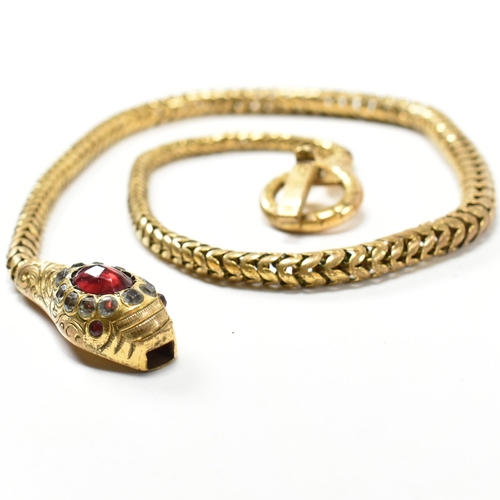 88 - A late Victorian/early Edwardian gilt metal and paste snake necklace. The necklace in the form of an... 