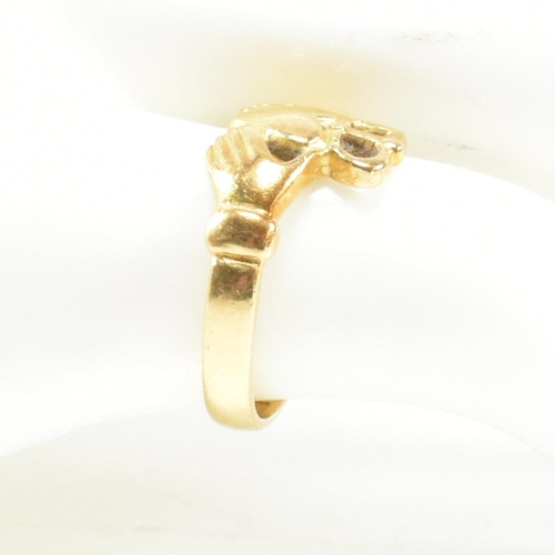 89 - An 18ct gold Claddagh ring. The Irish Claddagh ring bearing Egyptian hallmarks for 18ct gold. Size I... 