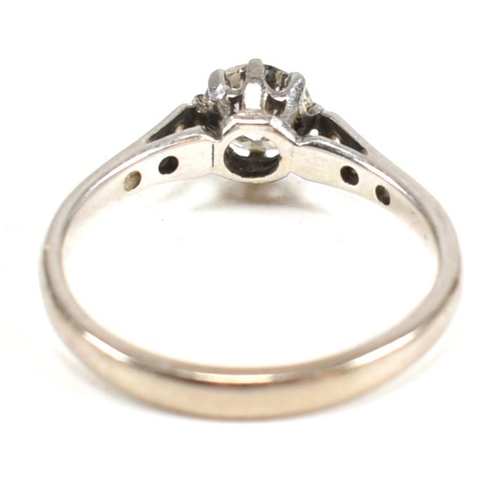 91 - An 18ct white gold and diamond solitaire ring. The ring having a central eight claw set round brilli... 