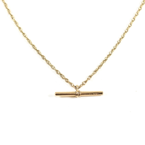 93 - A hallmarked 9ct gold T-bar necklace. The hallmarked Italian T-bar strung on a rope chain to lobster... 