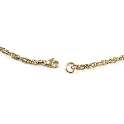 93 - A hallmarked 9ct gold T-bar necklace. The hallmarked Italian T-bar strung on a rope chain to lobster... 